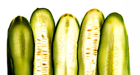 a sliced cucumber close up - textured backgroundの写真素材