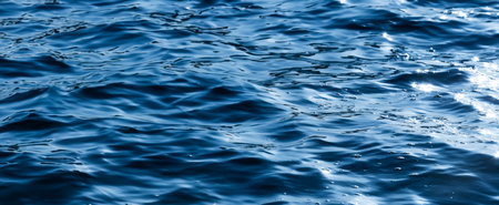 Sea waves with reflectionの写真素材