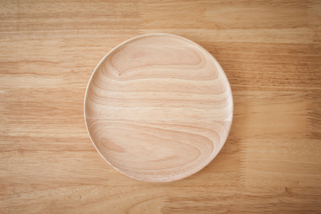 Round wooden plateの写真素材