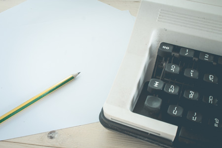 Antique typewriterBlank paper with pencil vintage toneの写真素材