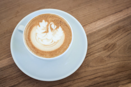 cappuccino coffee on wood tableの写真素材