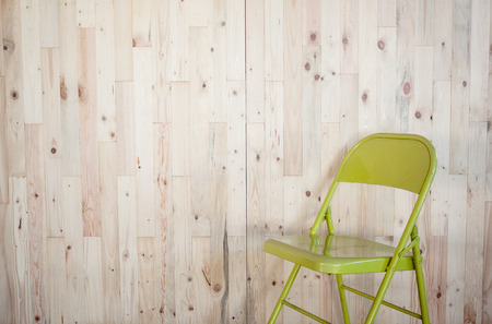wooden wall pine Light color / green chairの写真素材