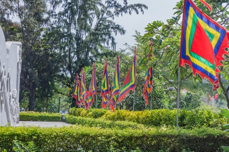 empty variegated flags fluttering in the windの写真素材