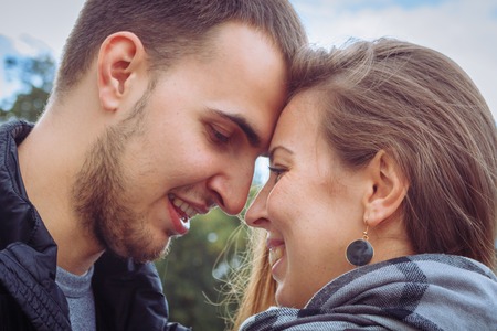 fashion of nice pretty young hipster woman with a handsome man look at each other.の写真素材