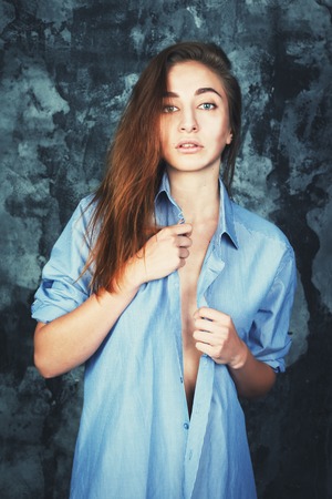 young sexy girl in a man's shirt.の写真素材