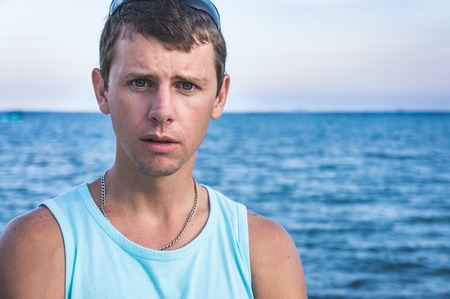 young man on the waterfront.の写真素材