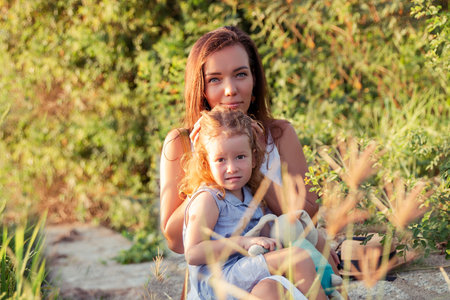 Young Mother and daugther Hug near rice field, nature, travel.の写真素材