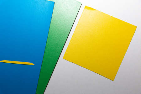 School accessories on a White table, sheet of paper and pencilsの写真素材