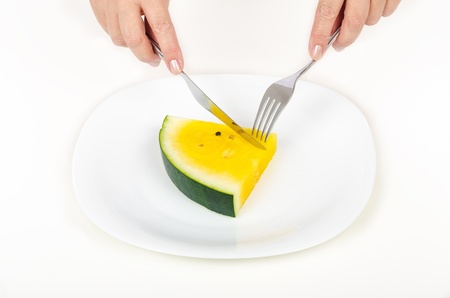 Lets try yellow watermelonの写真素材