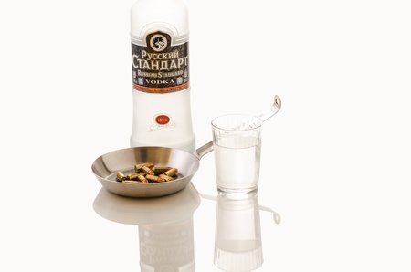 Full Glass Russian Vodka with skillet full 9mm balletsのeditorial素材