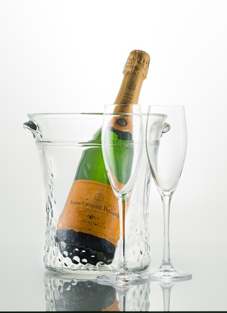 Veuve Clicquot Champagne with bucket and empty glassesのeditorial素材