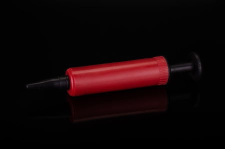 Red plastic syringeの写真素材