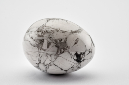 White howlite egg on white backgroudの写真素材