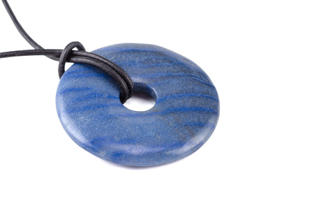 Dumortierite polished donut with leather stringの写真素材