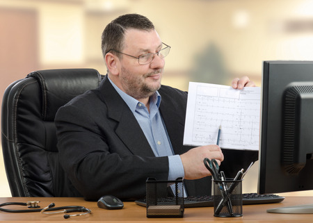 Accomplished doctor explains results of a medical outcomes to someone during telemedicine conference.の写真素材