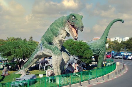 Rishon LeZion, Israel-April 25, 2017: Tyrannosaurus rex the most famous Jurassic predator raises with open huge mouth demonstrating the sharp white teeth. It is posing in Cinema City parkのeditorial素材