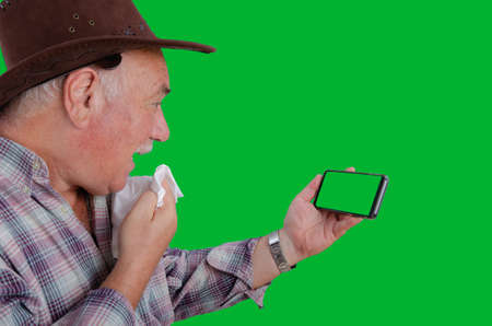 A joyful, delighted cry. The farmer received good news about his health. Perhaps the result of the analysis refuted the worst fears. Telemedicine or e-health concept.の写真素材