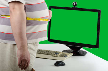 The fat man began to fight obesity. He turned to a dietitian on the Internet for help. Telemedicine or healthy food concept.の写真素材