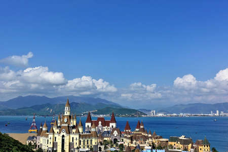 Vietnamese landscape. In the foreground is a castle for children's games, a cable car through the...