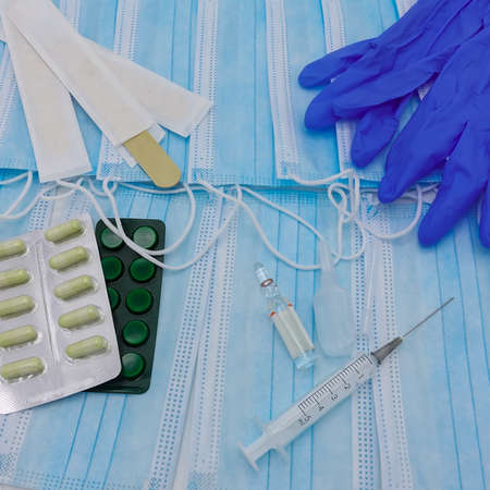 Disposable medical masks are spread out.