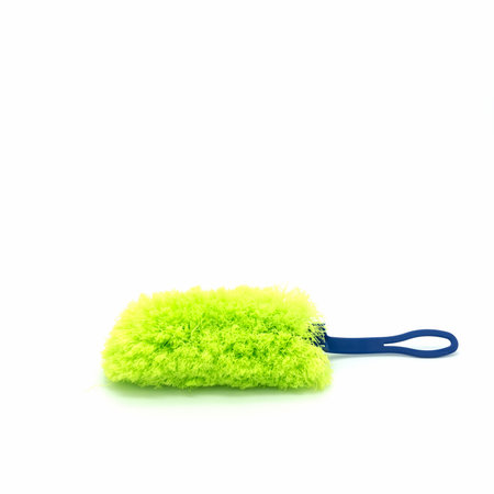 Microfiber dust brush with long soft fibers. Bright green pile, blue plastic handle. Isolated on a...