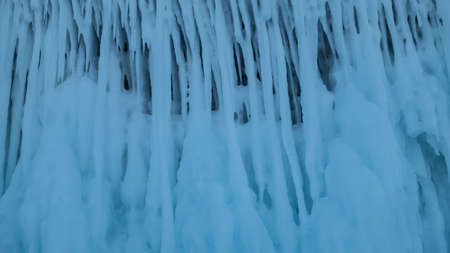 Fancy long icicles form a pattern. Close-up. Full screen. Details. Fantastic ice of Lake Baikalの写真素材