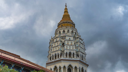 Beautiful multi-tiered Chinese pagoda Ban Po Thar against the sky and clouds. Columns, terraces, wall ornaments, roofs with curved edges. The spire is at the top. Kek Lok Si Templeの写真素材