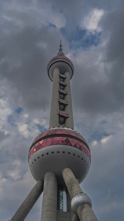 The tallest TV tower in China against the sky and clouds. Spherical and cylindrical architectural...