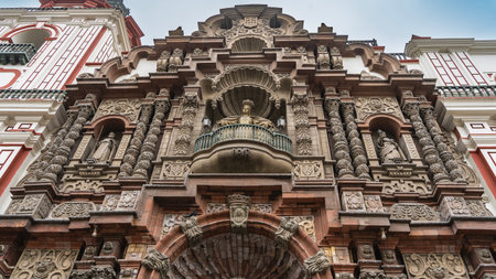 The facade of an ancient Catholic cathedral Convent of Santo Domingo. Beautiful carved columns, arches. There is a statues on the balcony. Spanish Colonial Revival architecture.の写真素材
