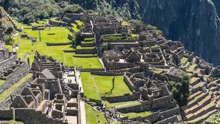 The famous Lost City of the Incas Machu Picchu. There are ruins of stone buildings with dilapidated...