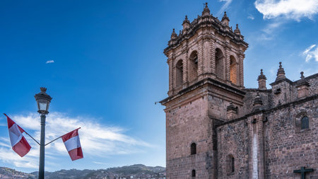 The ancient Cathedral Basilica of the Virgin. Weathered brick walls. A bell tower on a background of...