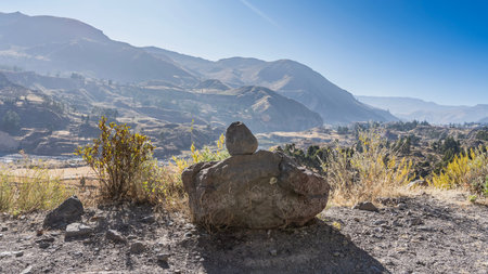 Highlands. There is a pyramid of stones on the observation deck. Dry grass on rocky ground. A...