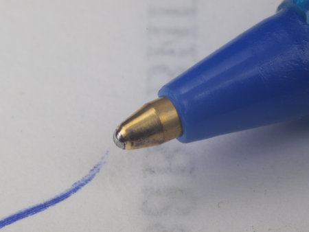 In the photo - Ballpoint pen. Stationery. Office Macrophotography.の写真素材