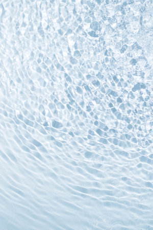 The background of blue water from drops spreads in different directions in interesting stains and stripes. Beautiful background vertical conceptの写真素材
