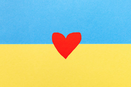 The flag of Ukraine is blue and yellow with a red heart in the center. Peace, love and freedom to the countryの写真素材