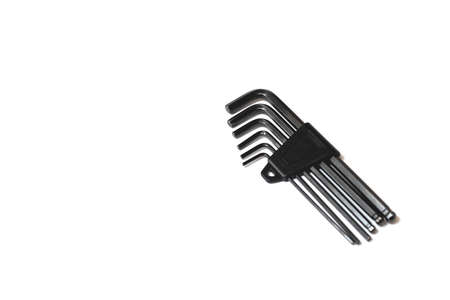 A set of black hexagons in a plastic case, isolated on a white background, a tool for repair work