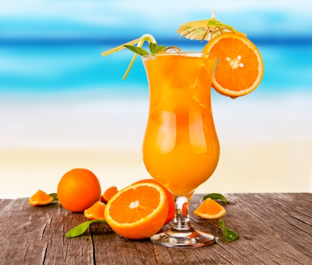 Summer drinks with blur beach on background の写真素材