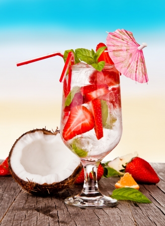Summer drinks with blur beach on background の写真素材