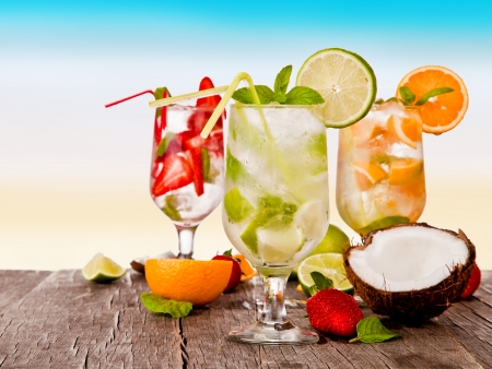 Summer drinks with blur beach on background の写真素材