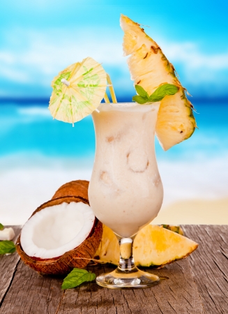 Summer drink with blur beach on background の写真素材