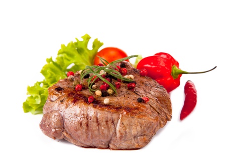 Grilled steak isolated on white background の写真素材