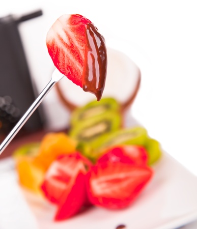 Chocolate fondue with fresh fruits の写真素材