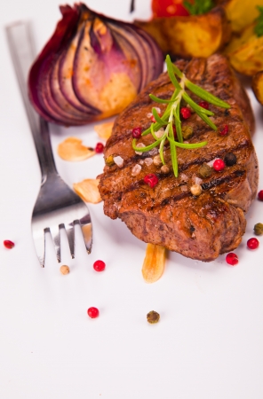 Grilled steaks on wood の写真素材