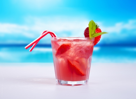 Summer drink with blur beach on background の写真素材