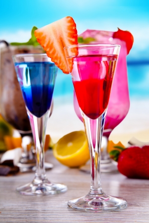 Summer drinks with blur beach on background の写真素材