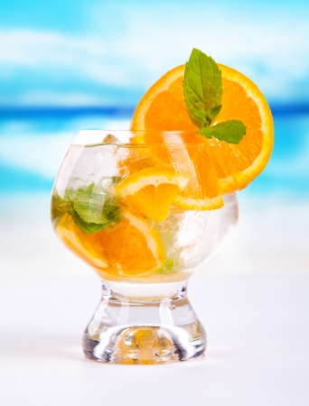 Summer drink with blur beach on background の写真素材