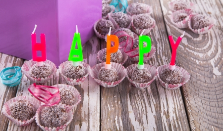 Sweet chocolate balls on wood, happy birthday conceptの写真素材