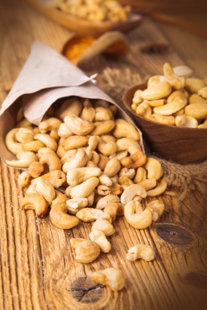 Cashew nuts on wooden tableの写真素材