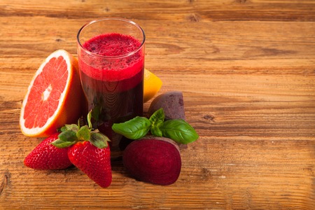 Beetroot juice on wooden tableの写真素材