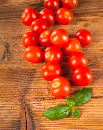 Tomatoes vegetable on wooden tableの写真素材